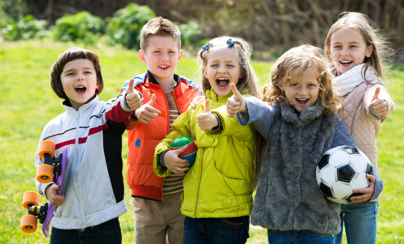 Cheerful,Kids,With,Ball,Having,Fun,Outdoors,In,Sunny,Day